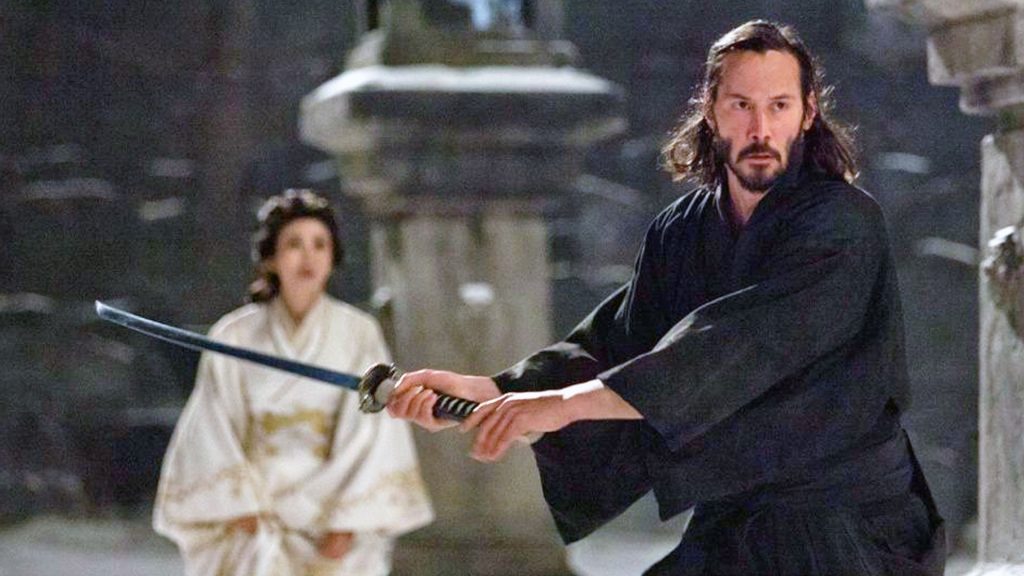 Keanu Reeves holding a katana and about to strike in 47 Ronin.