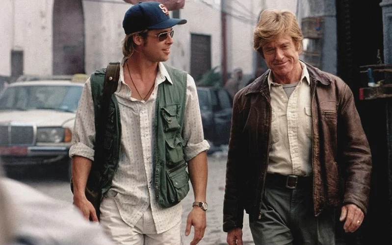 Brad Pitt and Robert Redford walking side by side in Spy Game.