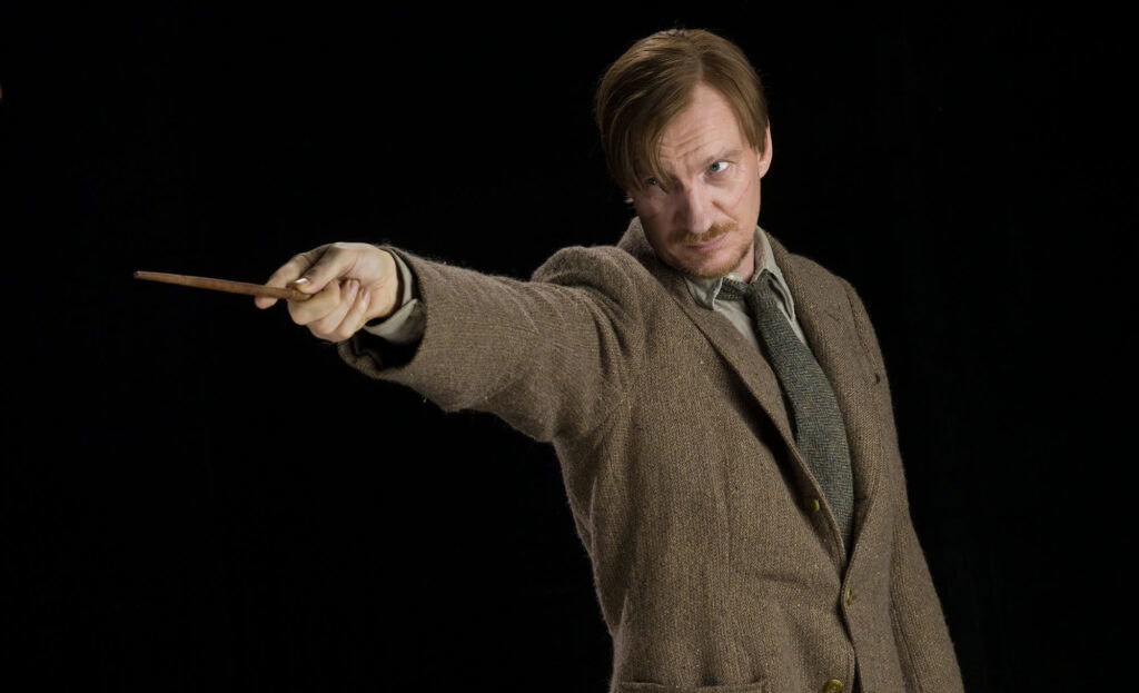 David Thewlis as Remus Lupin pointing his wand 