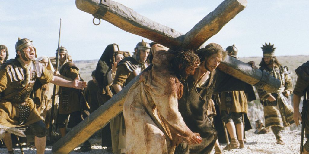 Jim Caviezel in The Passion of the Christ, where the final hours of Jesus' life, including his trial, scourging, and crucifixion at Golgotha, are depicted