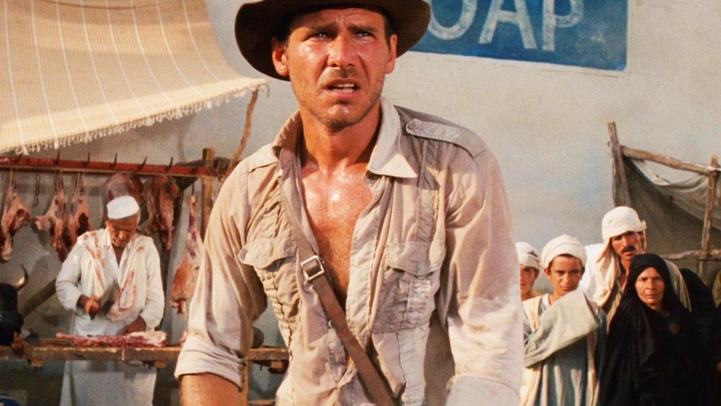 A still from the memorable bazaar scene from Raider of the Lost Ark starring Harrison Ford
