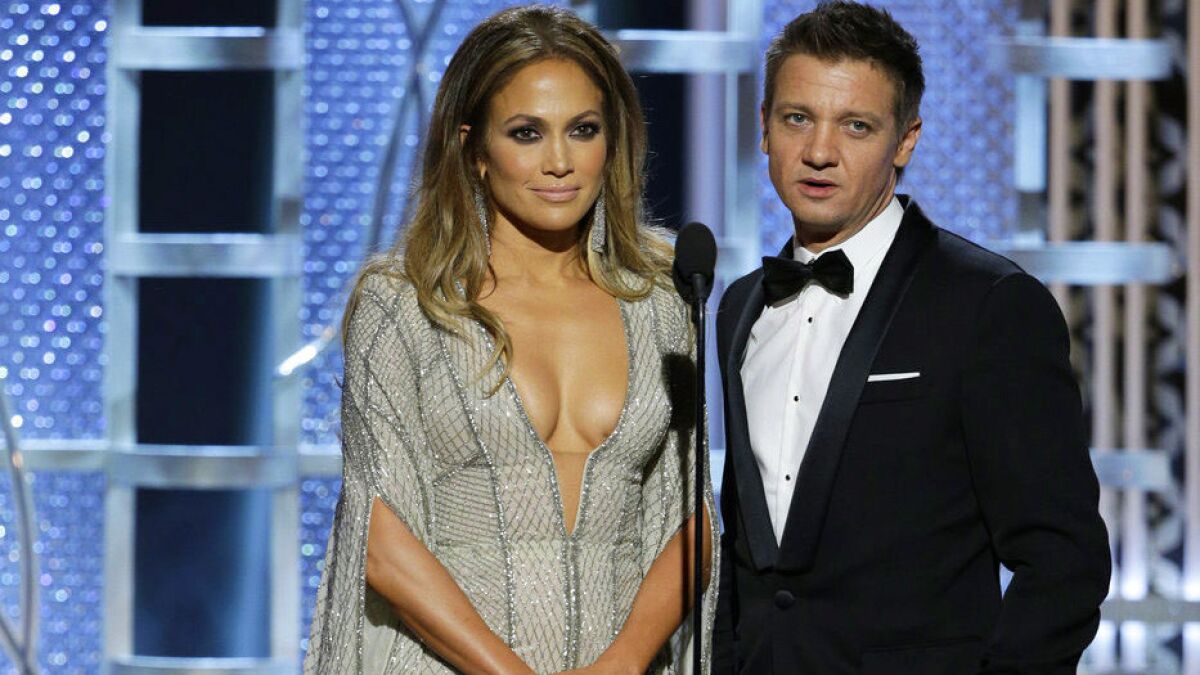 Lopez and Renner on the Golden Globe stage