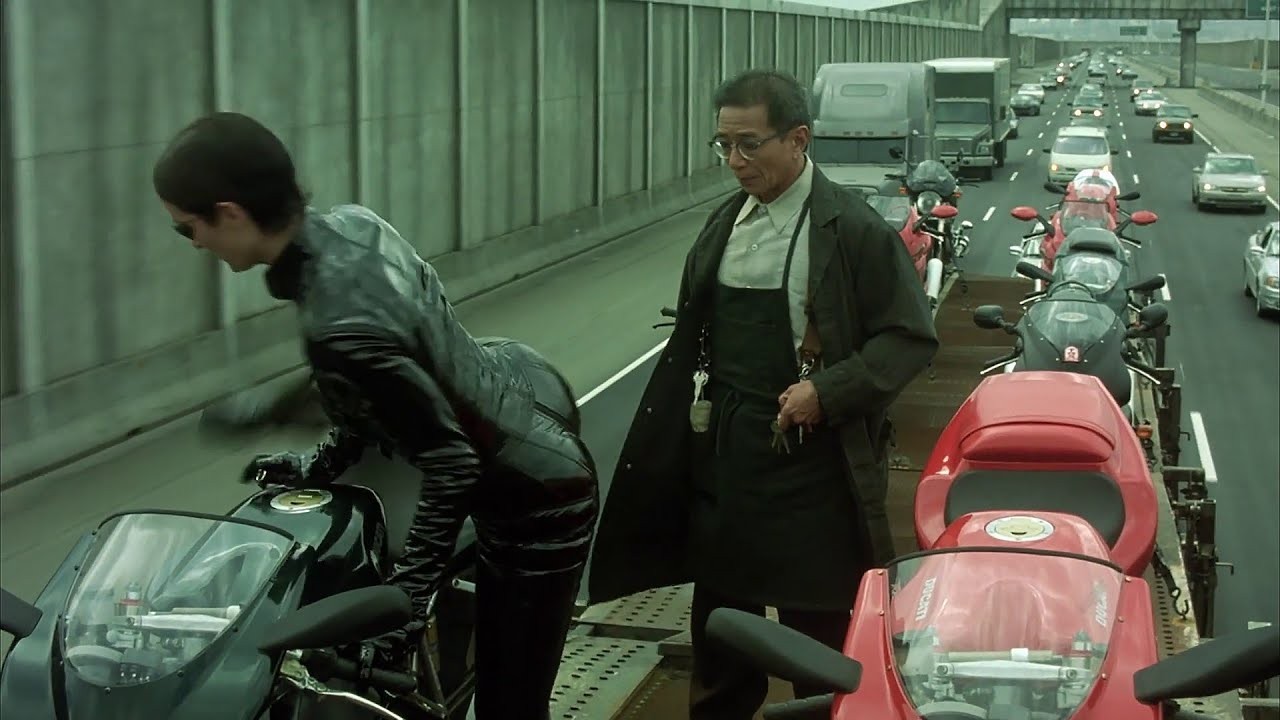 A still from the iconic bike chase scene in The Matrix Reloaded (2003)