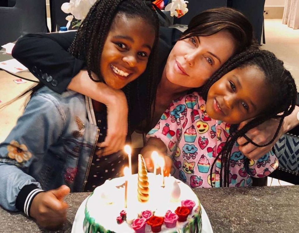 Charlize Theron with her African-American daughters