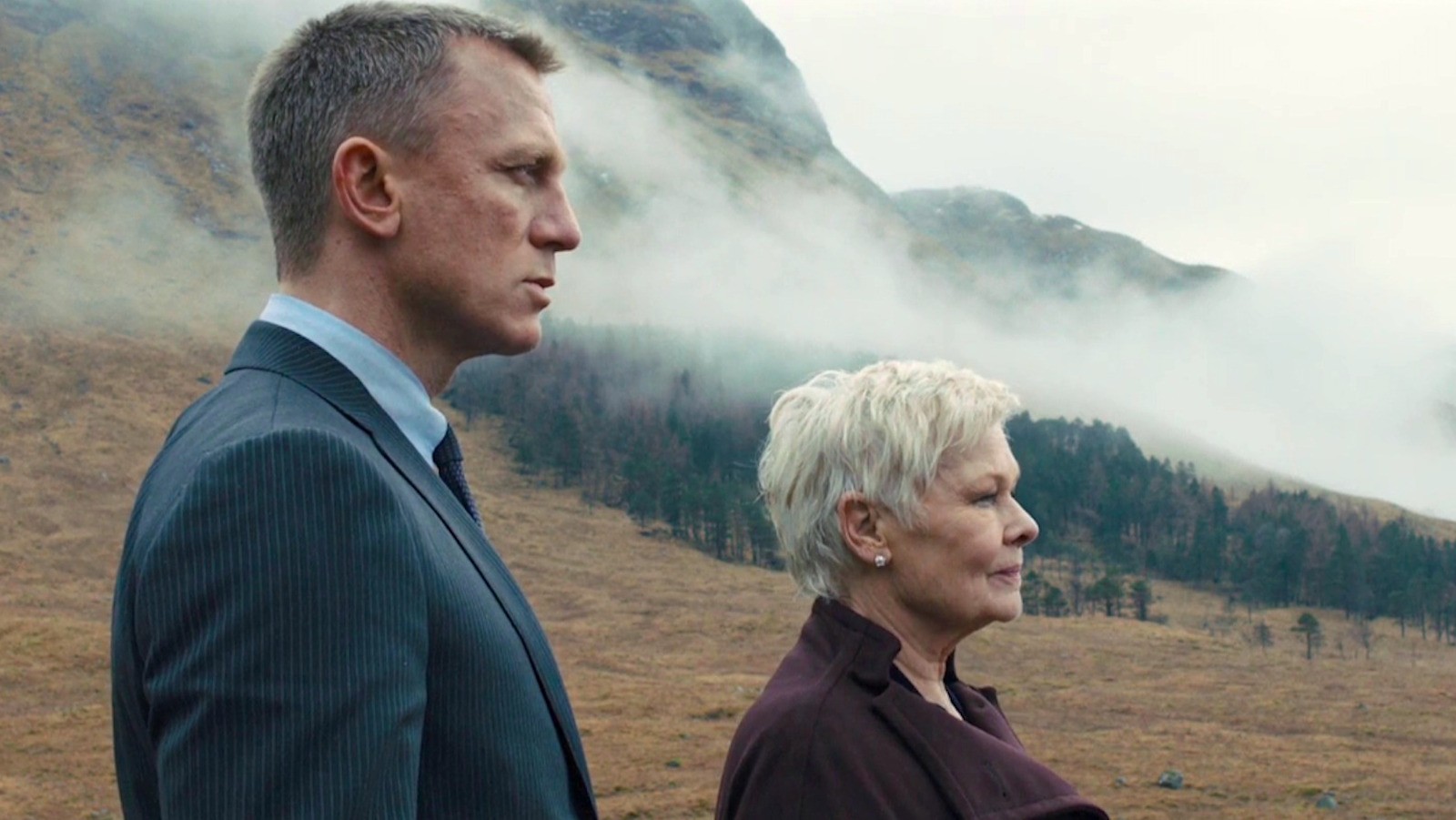 Judi Dench as M alongside Daniel Craig in the James Bond franchise.