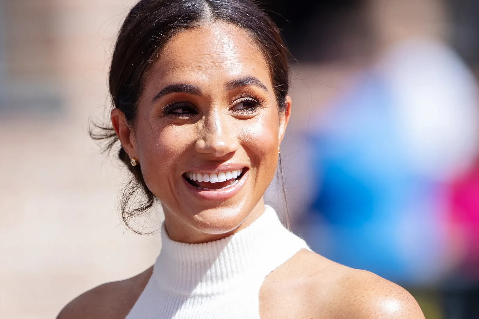 Meghan Markle smiling at the camera