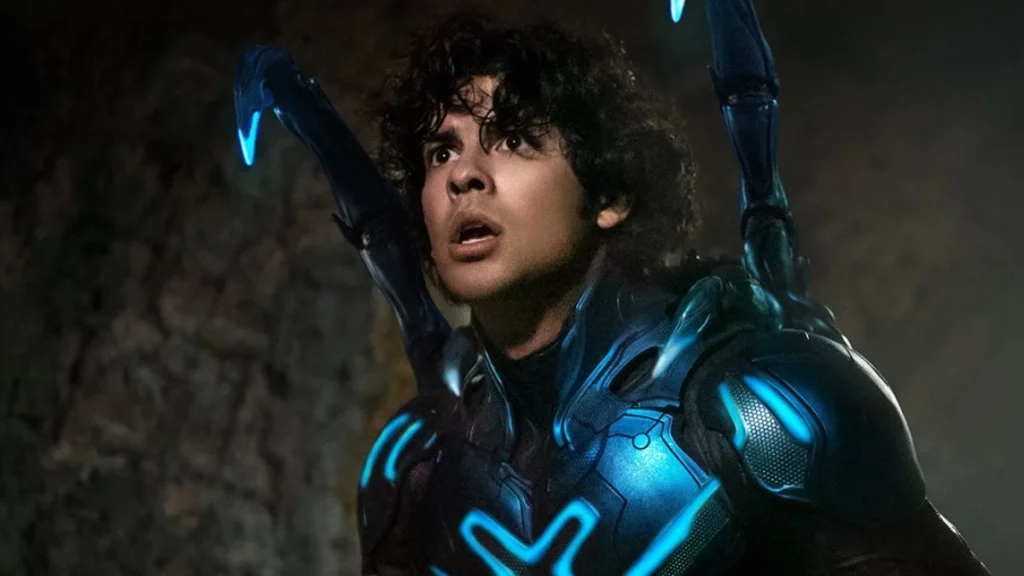 Xolo Maridueña in and as Blue Beetle (2023).