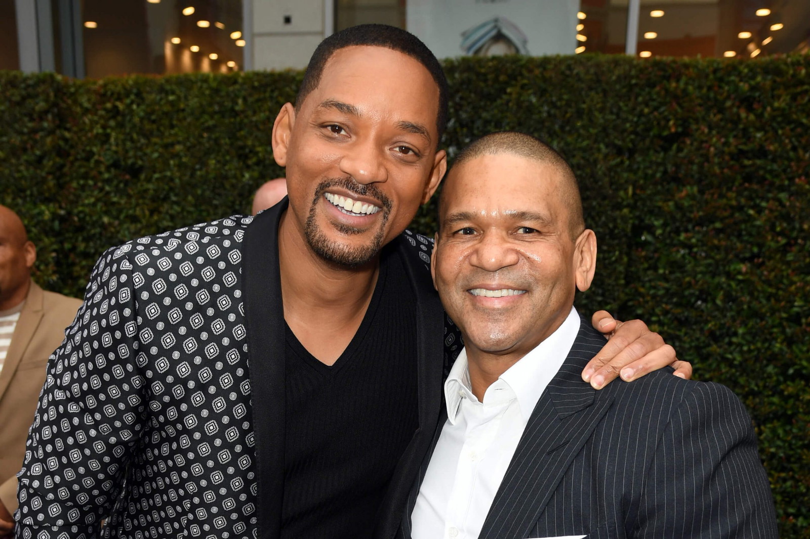 Will Smith and Benny Medina posing for photograph