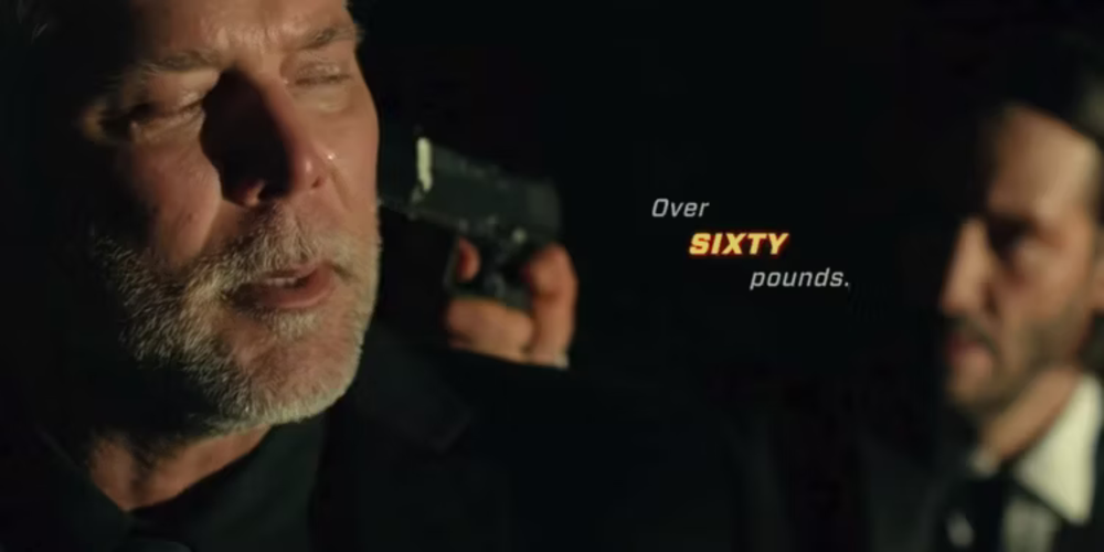 Kevin Nash's bouncer threatened by John Wick - a scene from the movie