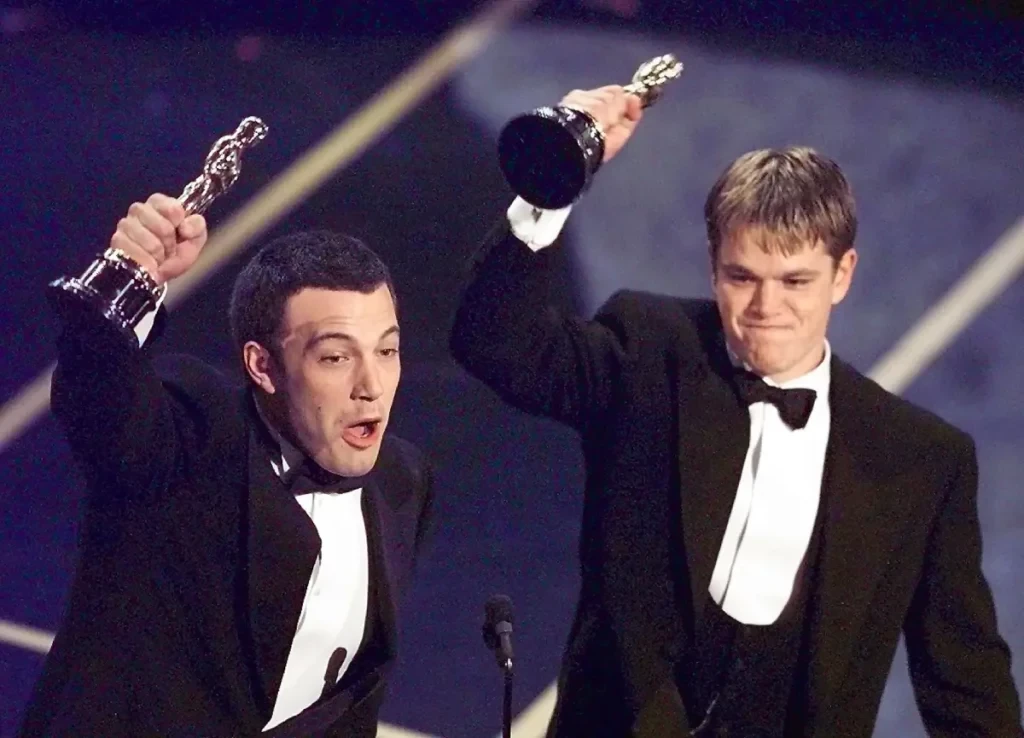 Ben Affleck and Matt Damon celebrating their Oscar win for Good Will Hunting