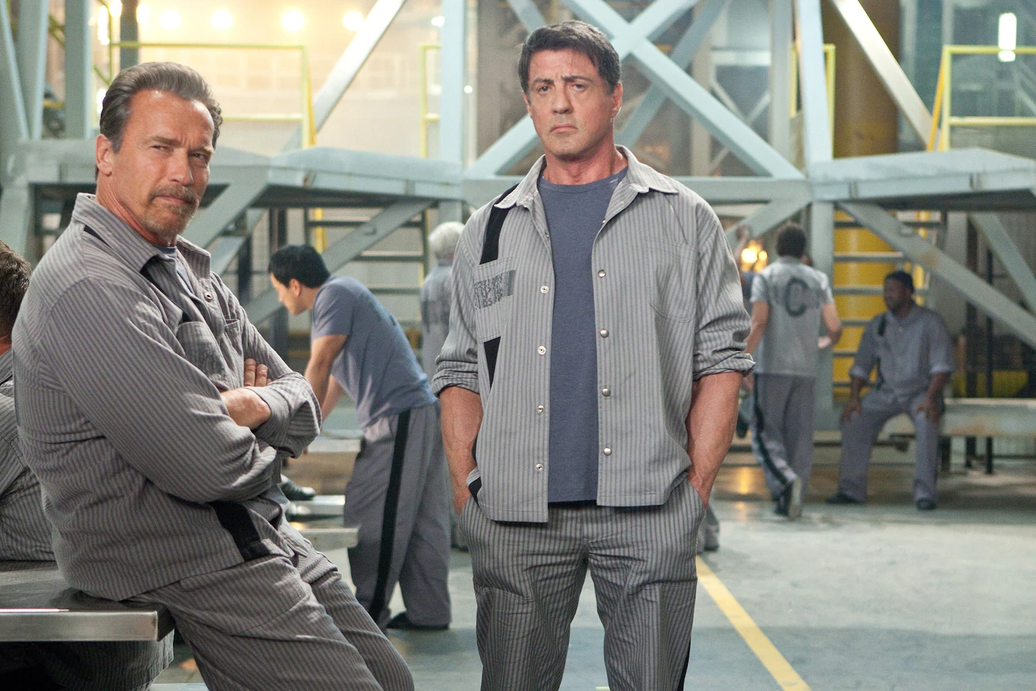 Arnold Schwarzenegger and Sylvester Stallone in a scene from Escape Plan