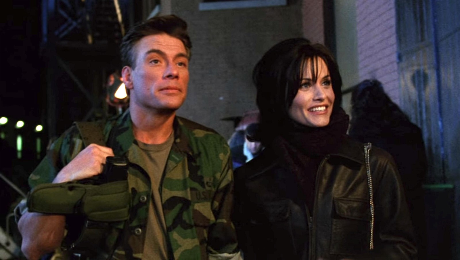 Jean-Claude Van Damme with Courteney Cox from a still in the Friends episode