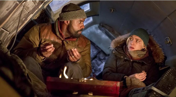 Idris Elba and Kate Winslet in “The Mountain Between Us