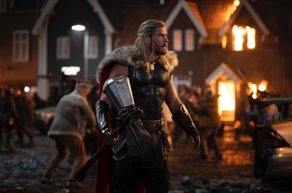 Chris Hemsworth with Stormbreaker in a still from Thor: Love and Thunder (2022)