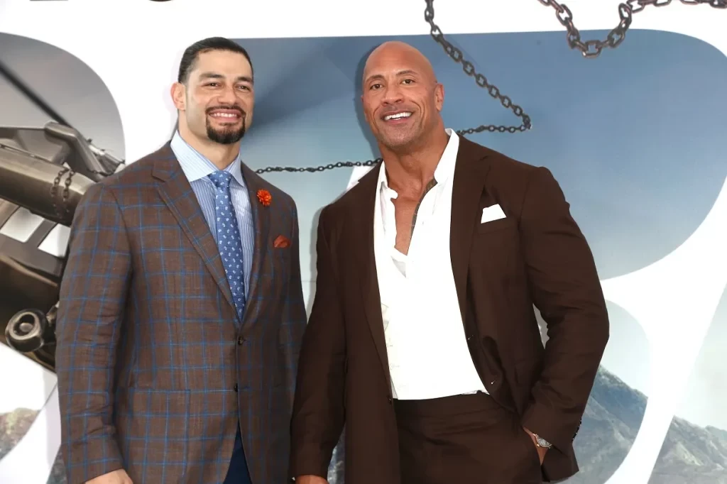 Roman Reigns and Dwayne Johnson at an event