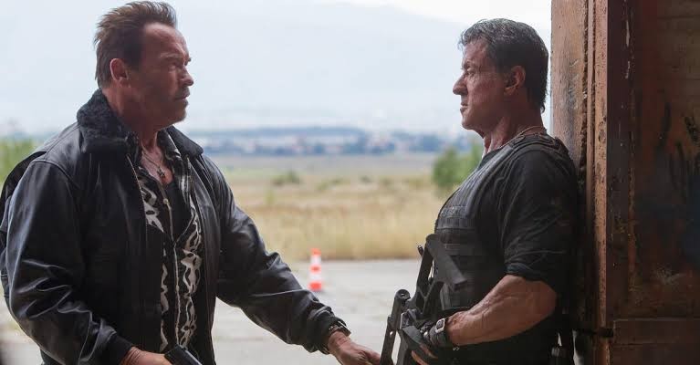 Sylvester Stallone with Arnold Schwarzenegger in The Expendables