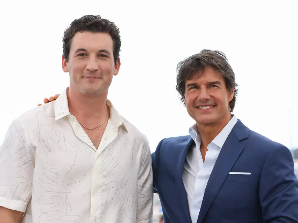 Miles Teller and Tom Cruise