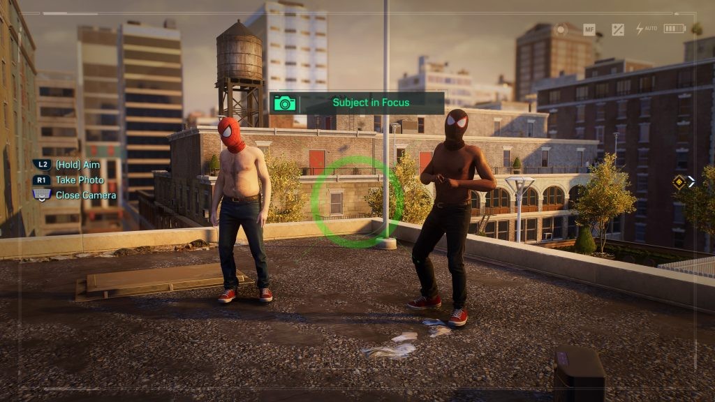 Take a photo of the two shirtless Spider-Men for Upper West Side’s Photo Ops in <em>Marvel's Spider-Man 2</em>.
