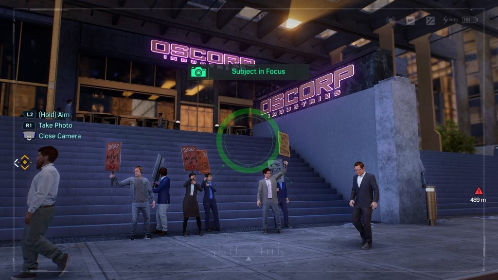 Take a photo of the protesters in front of the Oscorp Building for the Midtown Photo Ops in <em>Marvel's Spider-Man 2</em>.