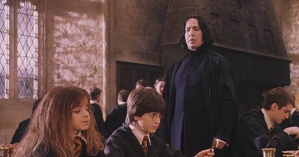 Professor Severus Snape teaching Harry Potter and Hermione 