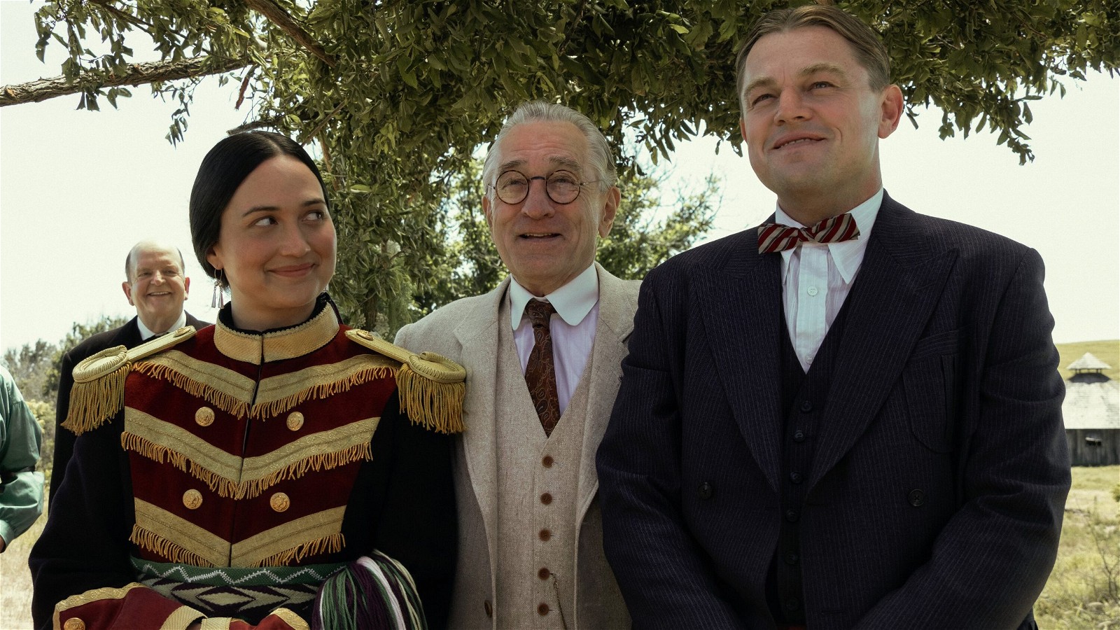 Lily Gladstone as Molly Burkhart, Robert De Niro as William King Hale, and Leonardo DiCaprio as Ernest Burkhart in Killers of the Flower Moon