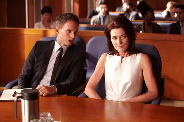 Patrick J. Adams and Michelle Fairley in Suits
