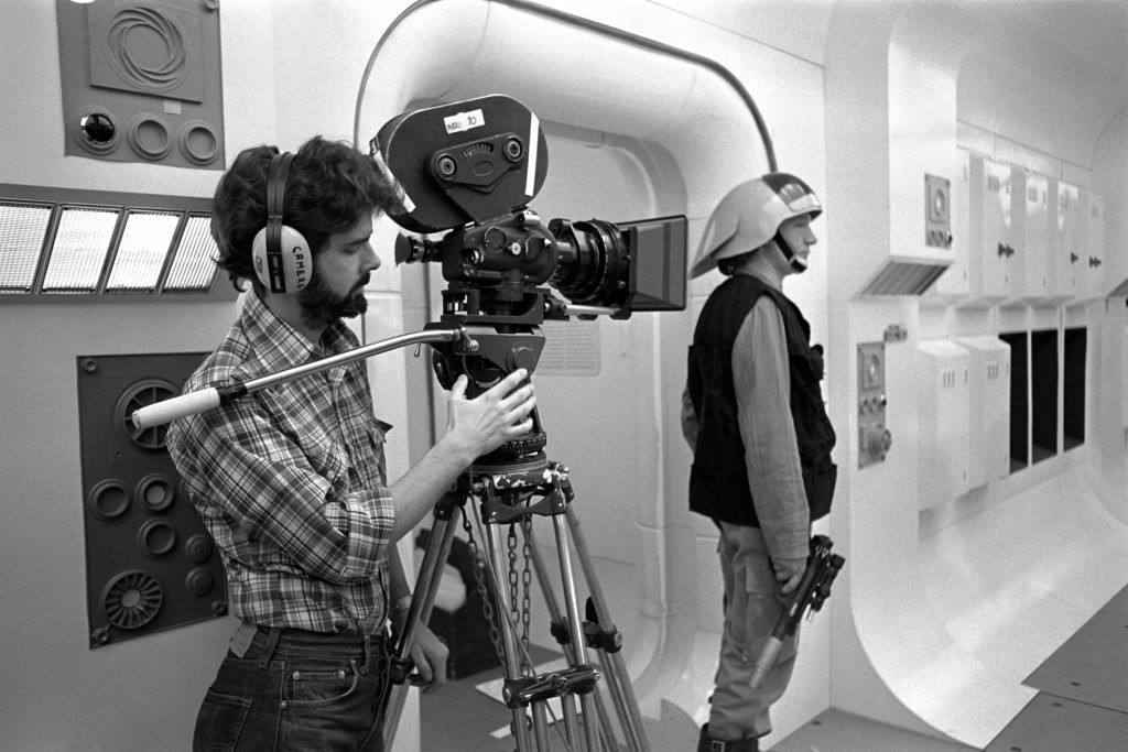 Lucas on set filming the opening scene of Star Wars: Episode IV - A New Hope. (Credit: Lucasfilm)