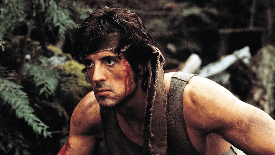 Sylvester Stallone looking at his surroundings in 'Rambo.'