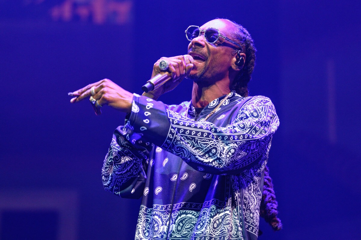 Snoop Dogg performing during a concert 