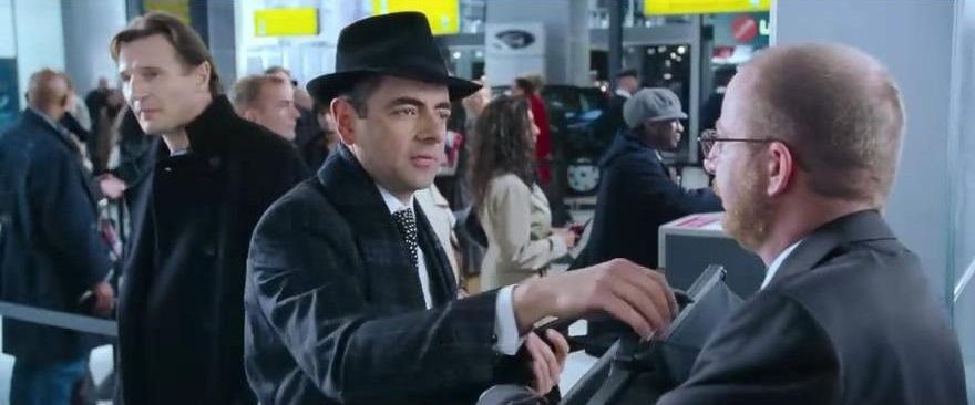 Rowan Atkinson appears in another scene.