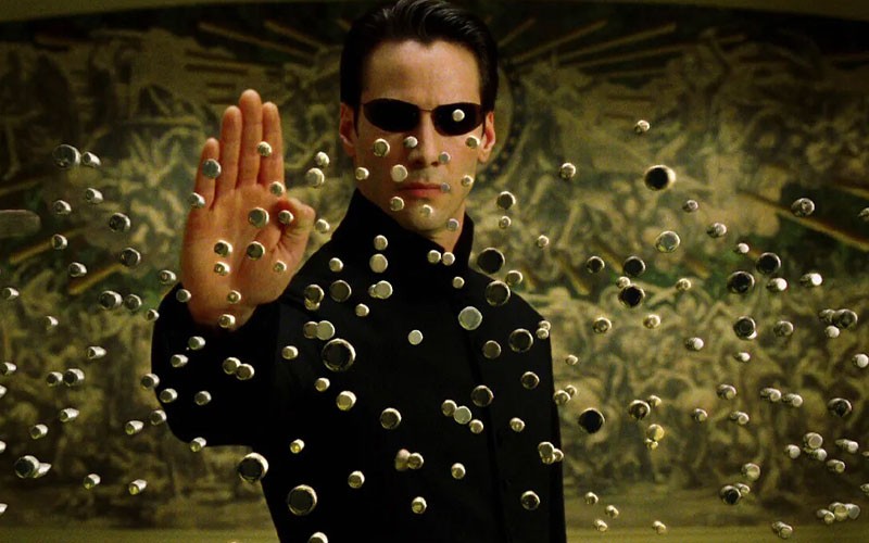 Keanu Reeves performing his iconic move in The Matrix 