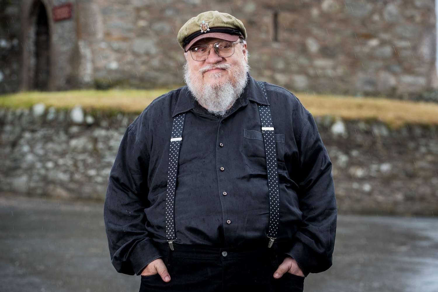 George R.R. Martin posing for the camera after bagging a lucrative deal with HBO