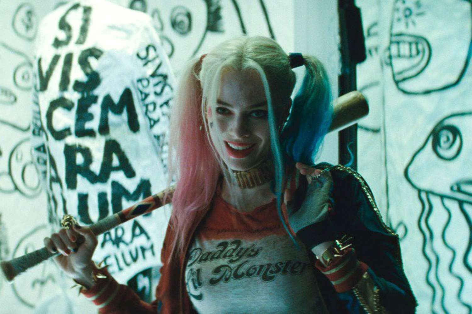 Margot Robbie smiling while portraying her role as Harley Quinn