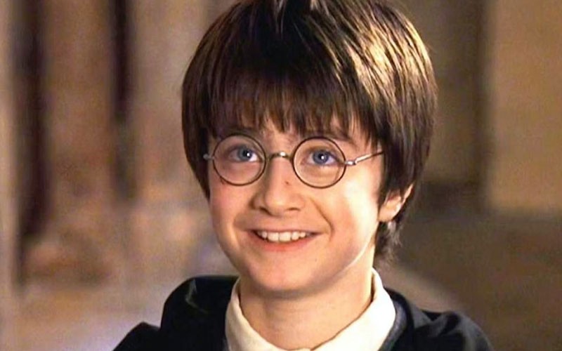 Daniel Radcliffe smiling in this scene from Harry Potter and the Sorcerer’s Stone