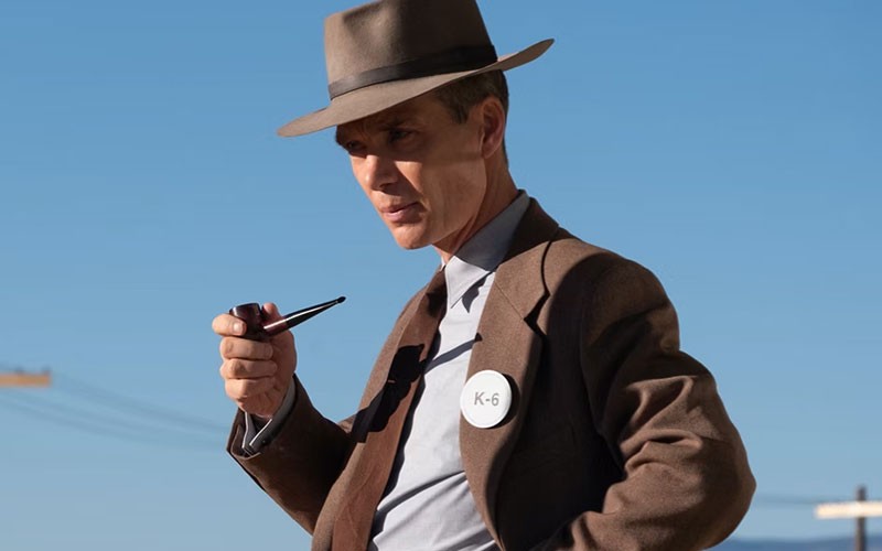 Cillian Murphy observing his surroundings in this scene from Oppenheimer 