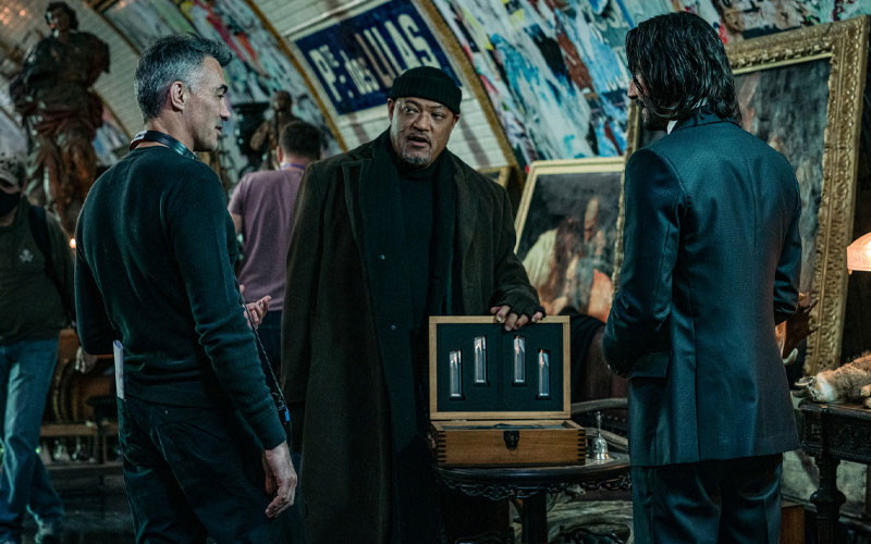 Chad Stahelski with John Wick cast members during a filming of a scene 