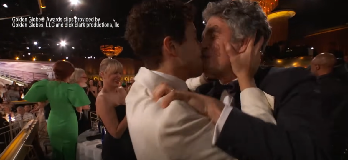 Mark Ruffalo and Ramy Youssef kissing at the 81st Golden Globe Awards