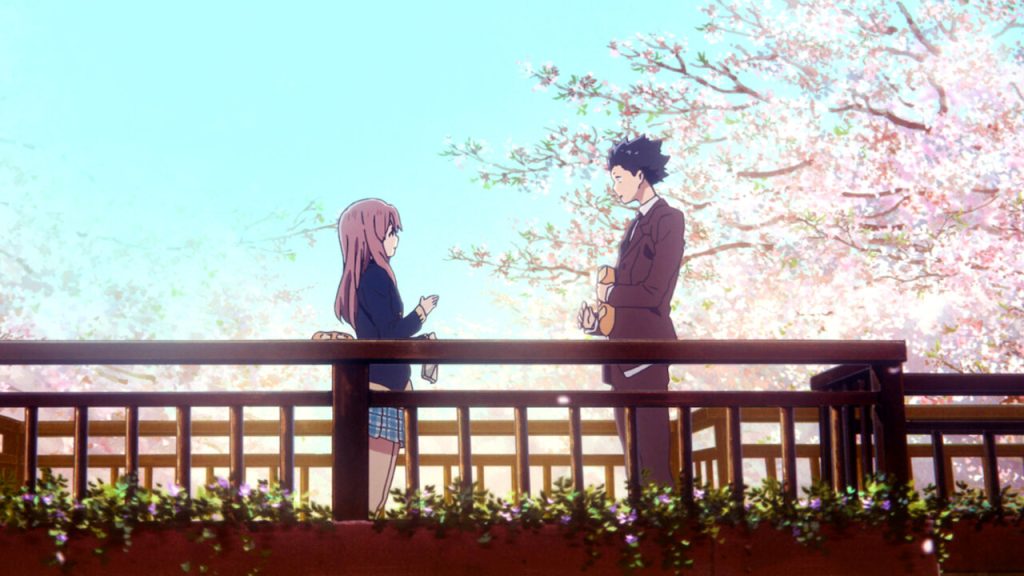 a still image of ishida and nishimiya standing facing each other under the cherry blossoms in a silent voice anime movie