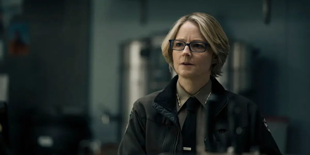 Jodie Foster wearing a jacket and a tie