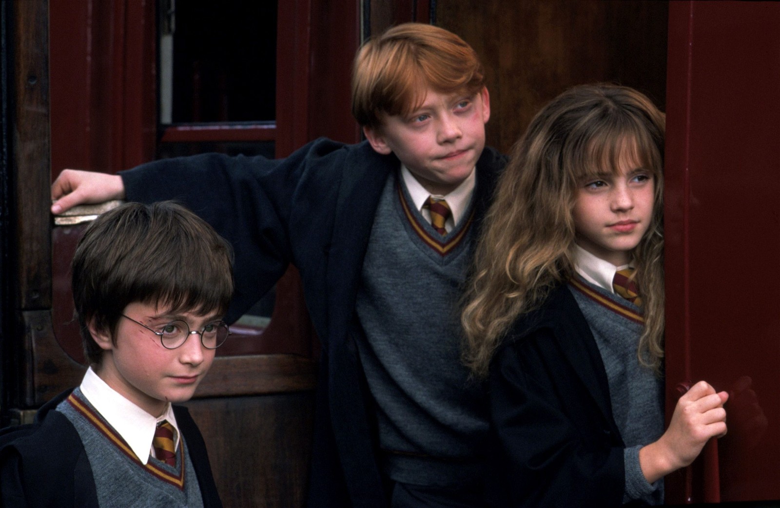 Daniel Radcliffe, Rupert Grint, and Emma Watson in the first film, Harry Potter and the Sorcerer's Stone