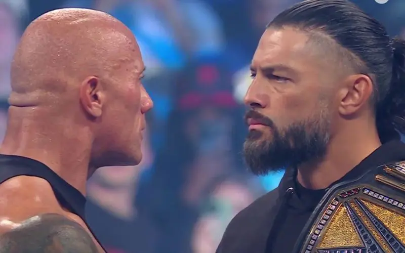 The Rock and Roman Reigns give a staredown 