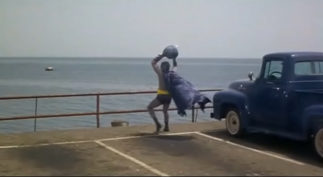 Adam West as Batman holding the bomb in this scene 