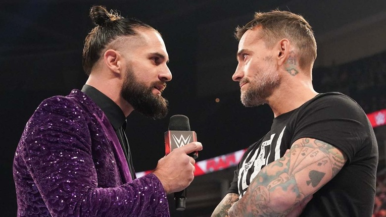 Seth Rollins and CM Punk during a promo battle on RAW last year 
