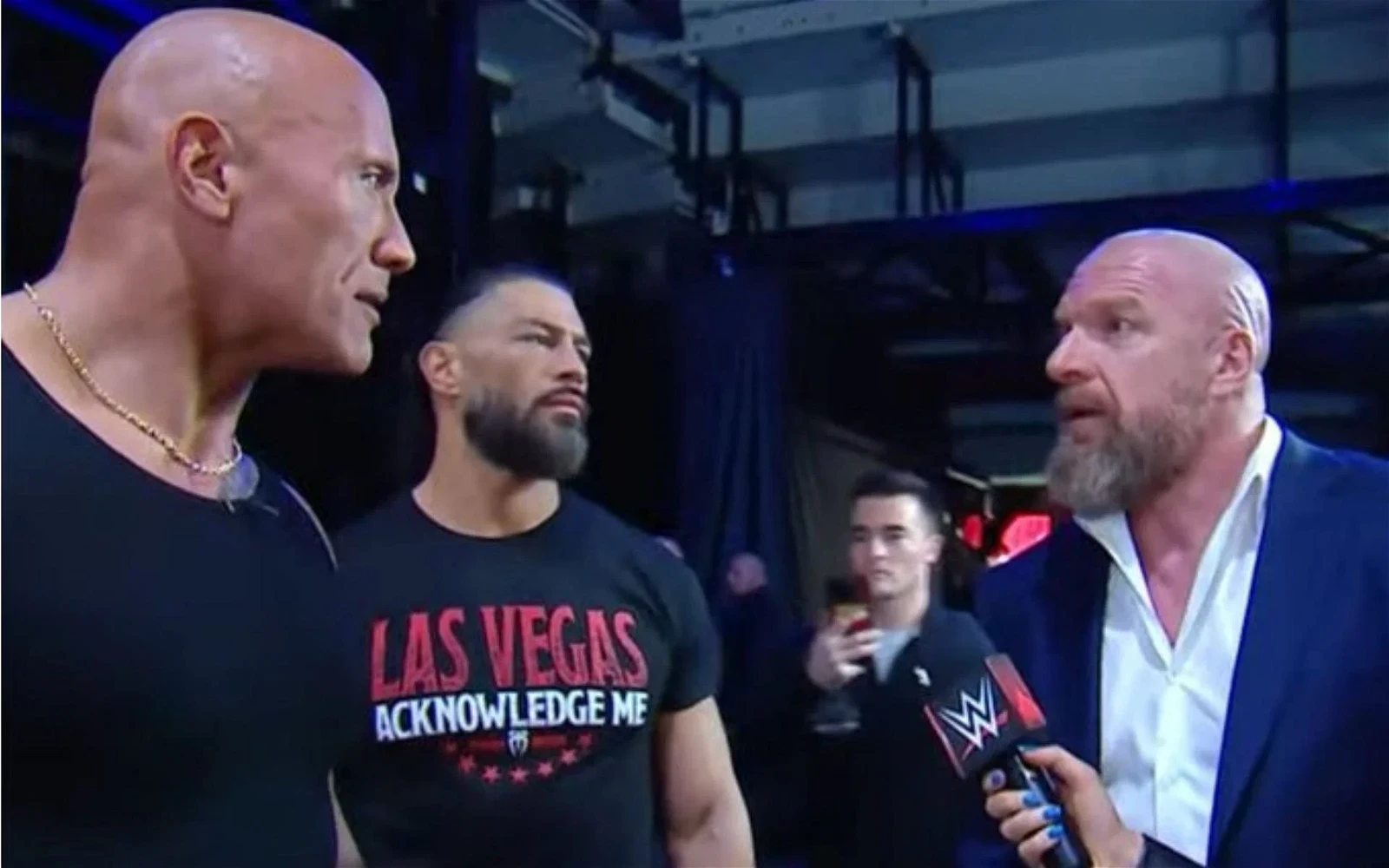 The Rock and Triple H share a tense moment 