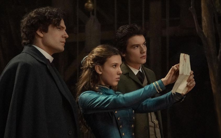 Henry Cavill, Millie Bobby Brown, and Louis Partridge in Enola Holmes 2 (2022)