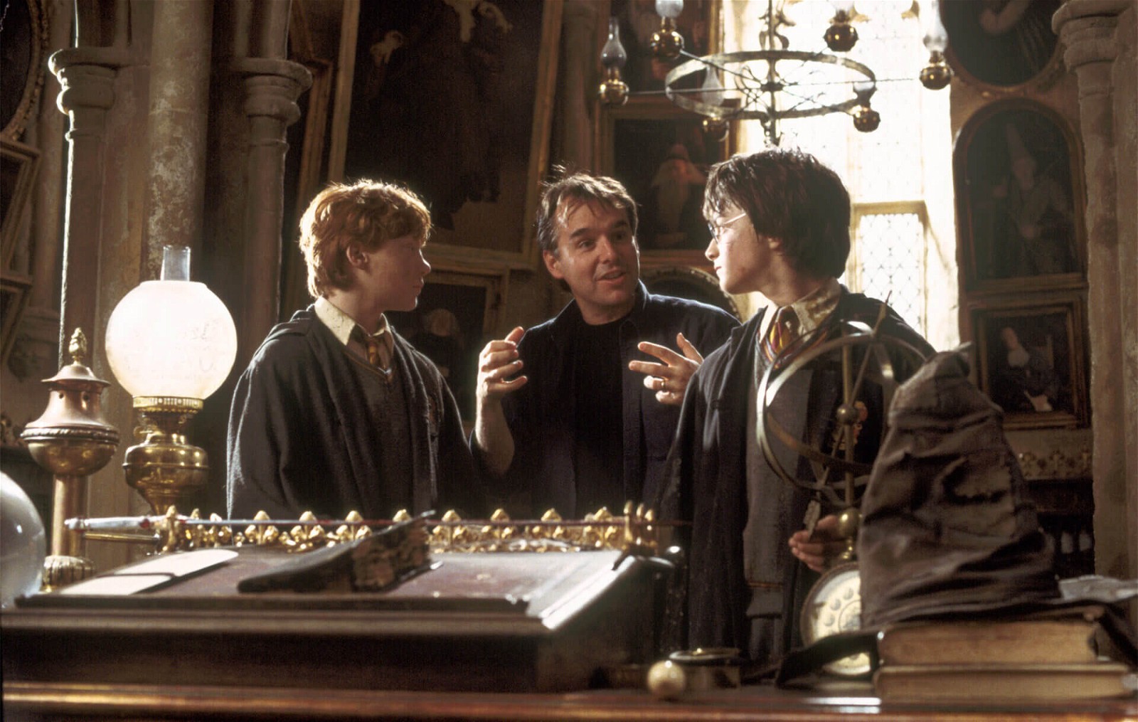 Chris Columbus with Daniel Radcliffe and Rupert Grint