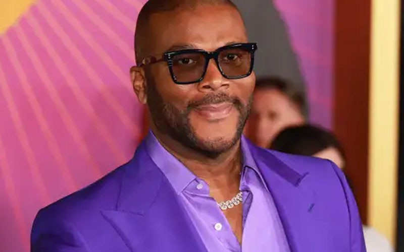 Tyler Perry smiling here