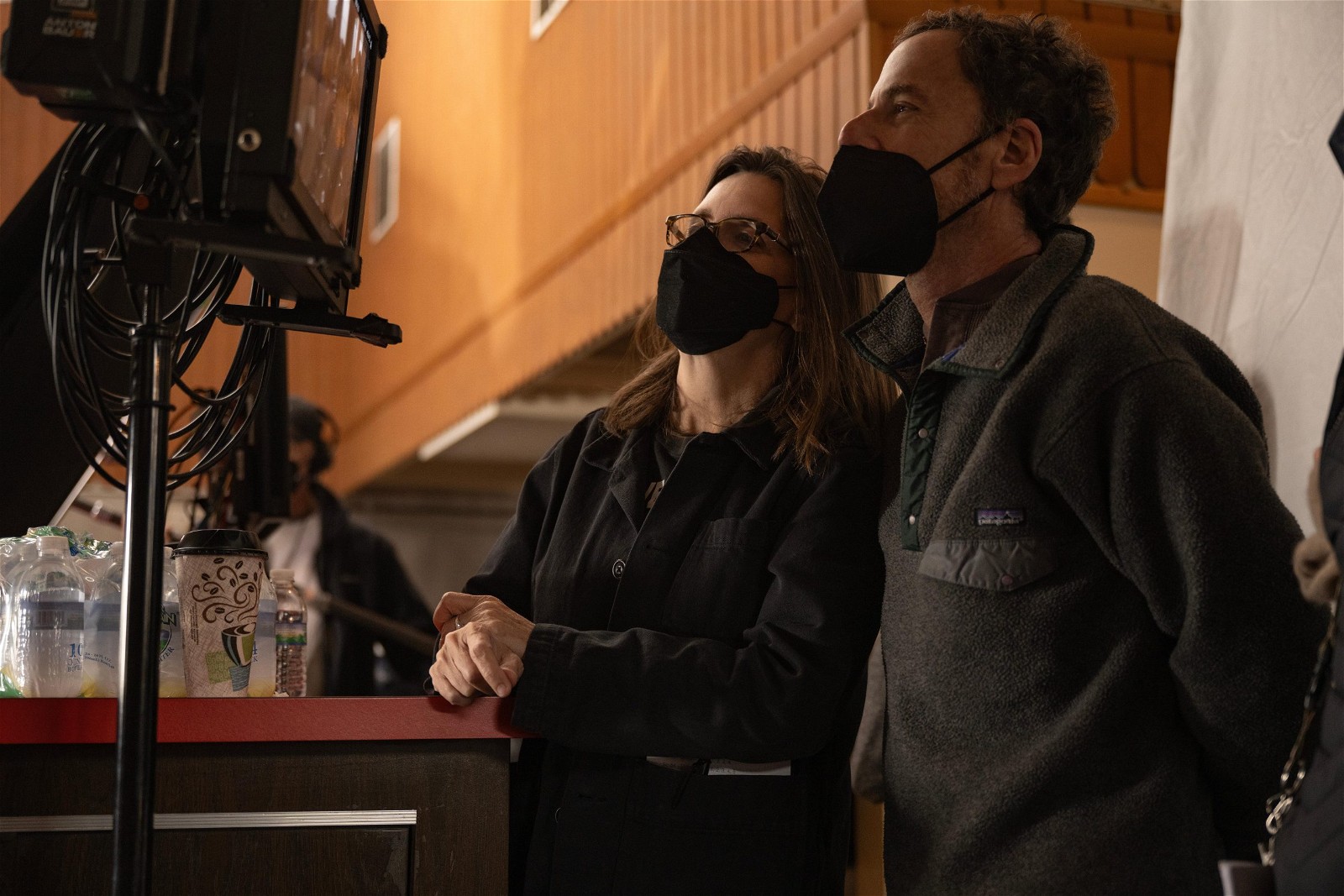 Tricia Cooke and Ethan Coen on the set of Driive-Away Dolls