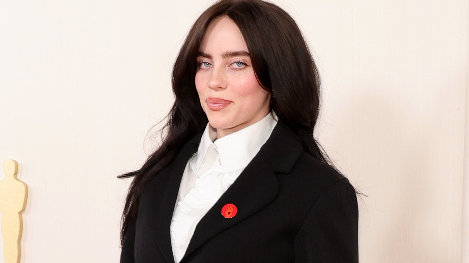 Billie Eilish was spotted with the red lapel pin (Credits: The New York Times)