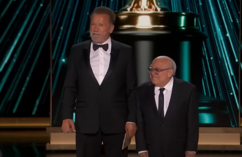 Arnold Schwarzenegger and Danny DeVito at the 2024 Oscars (image via ABC News | Youtube)